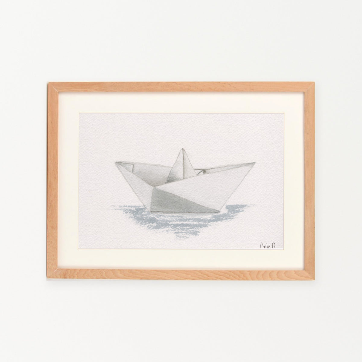 Barco de papel enmarcado en madera nativa
